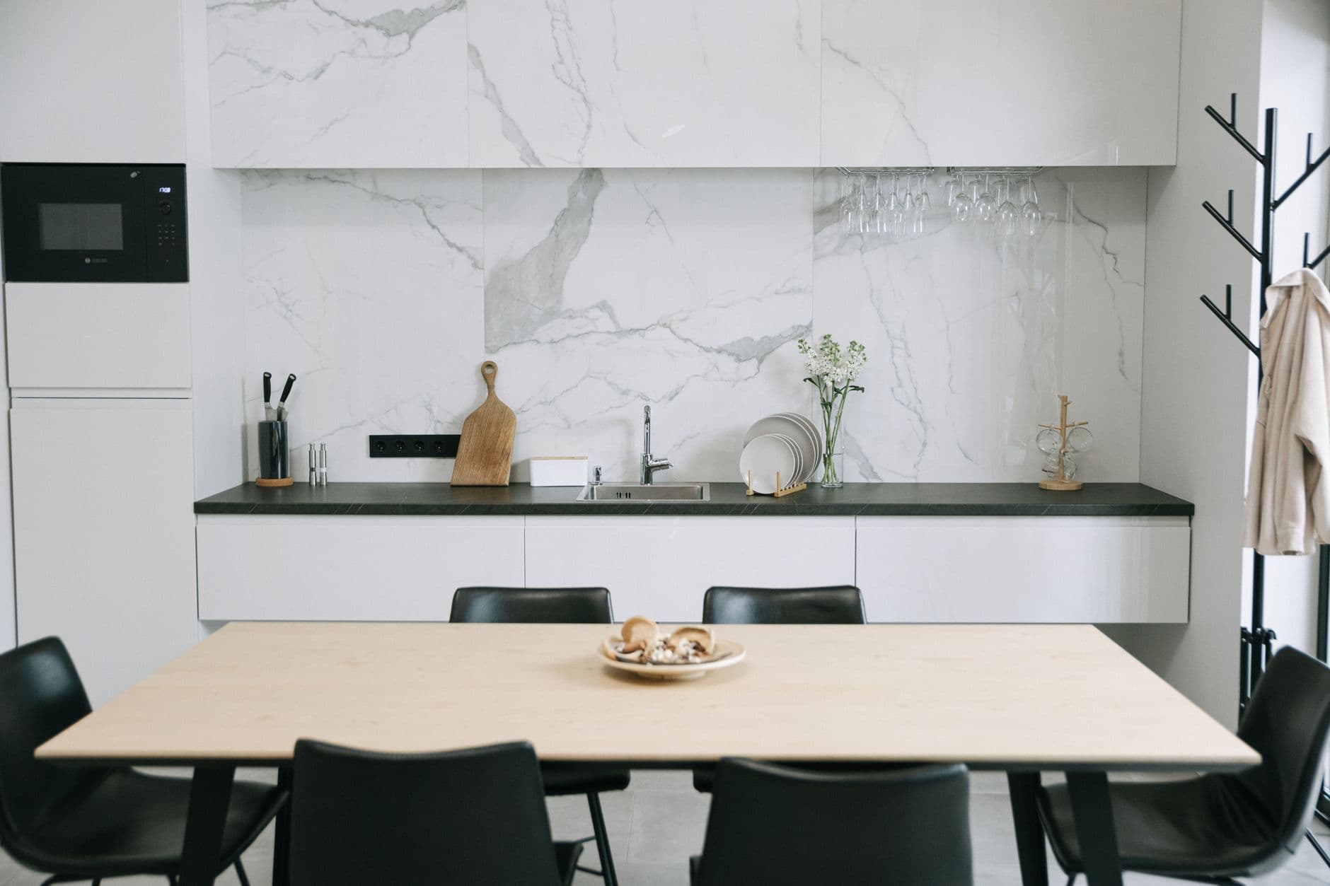 Warm timber kitchen with restrained metal fittings and a pale work surface