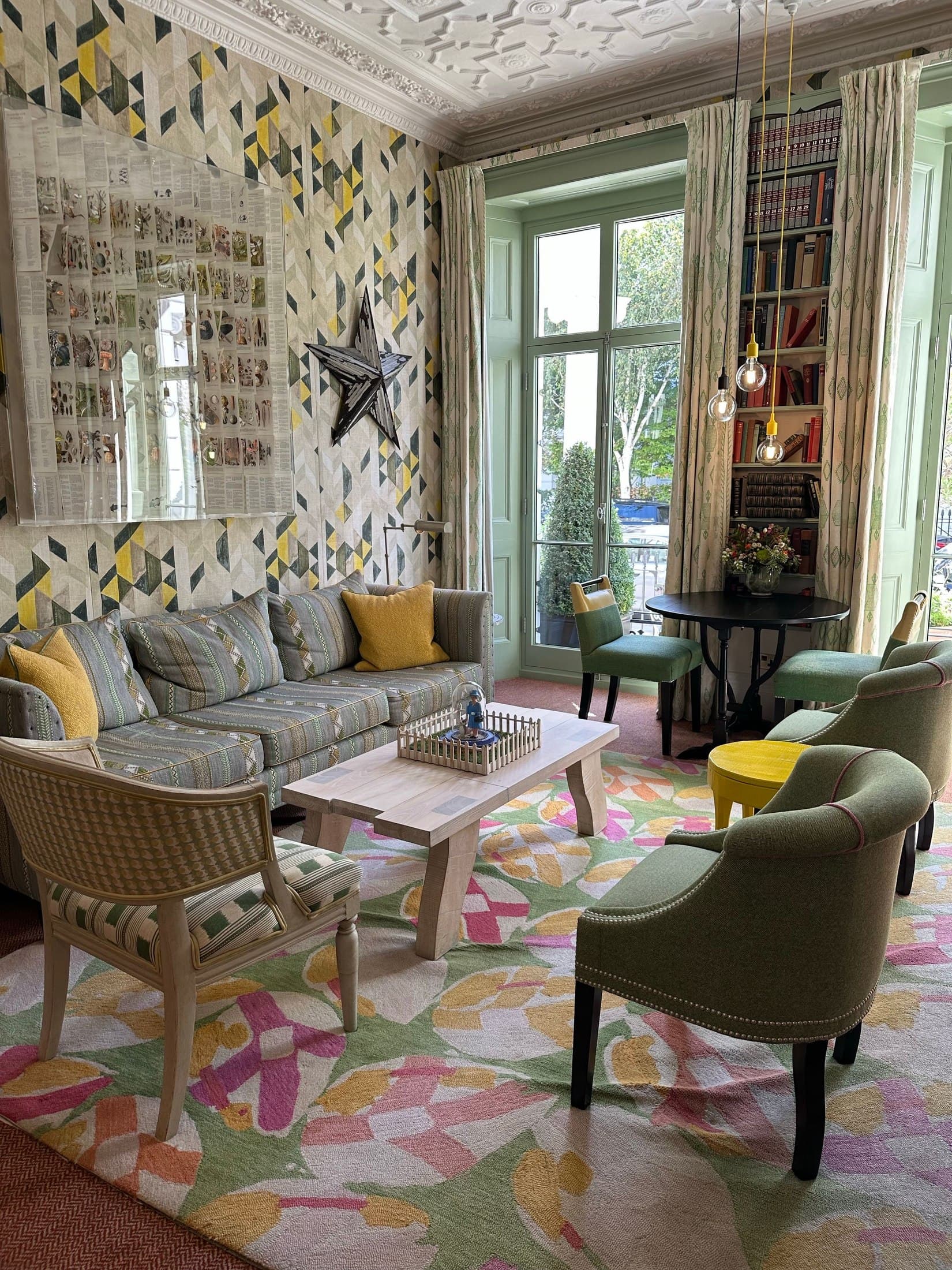 Bright eclectic room with contemporary seating and patterned textiles