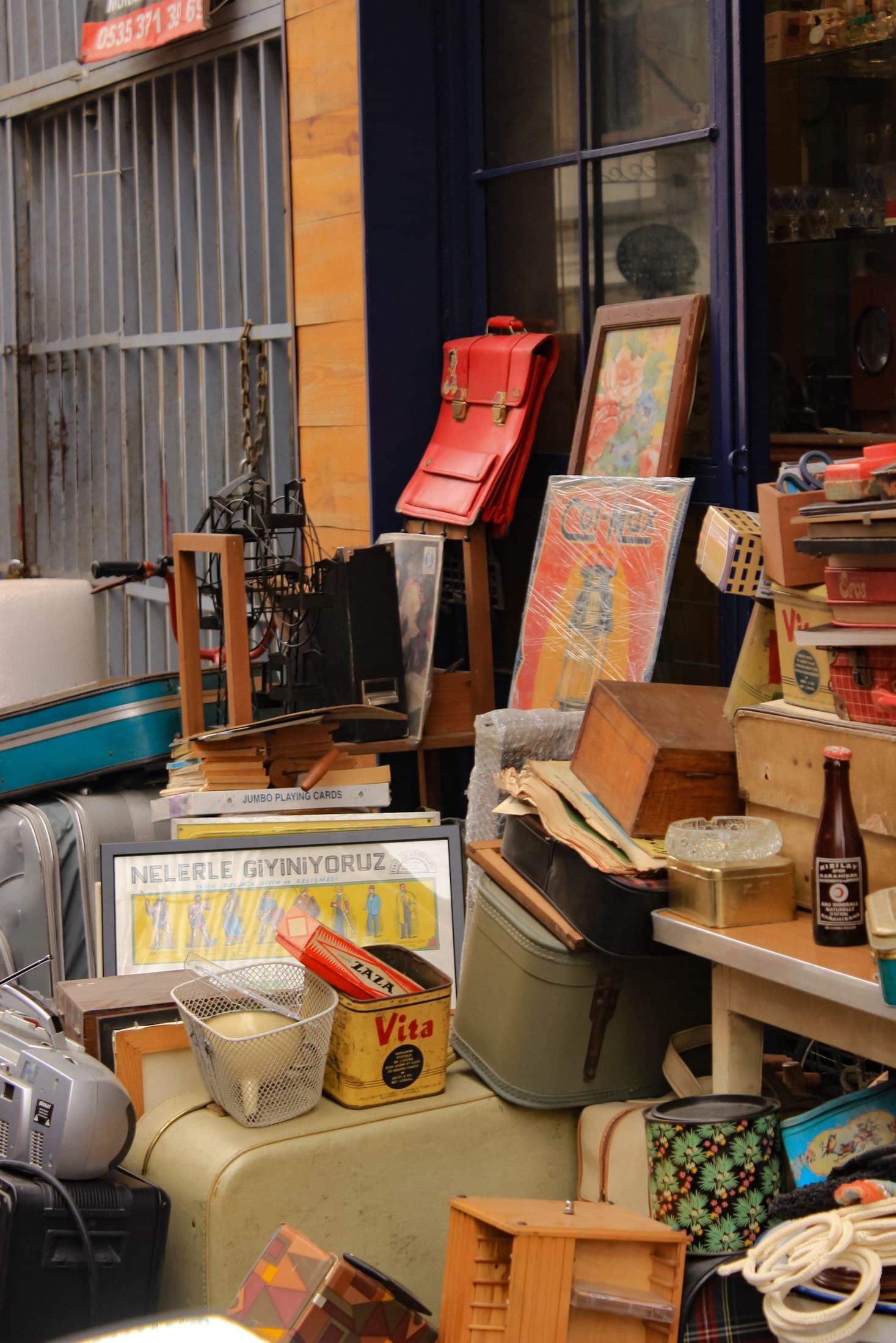 Flea market stall with vintage furniture, art and collected objects