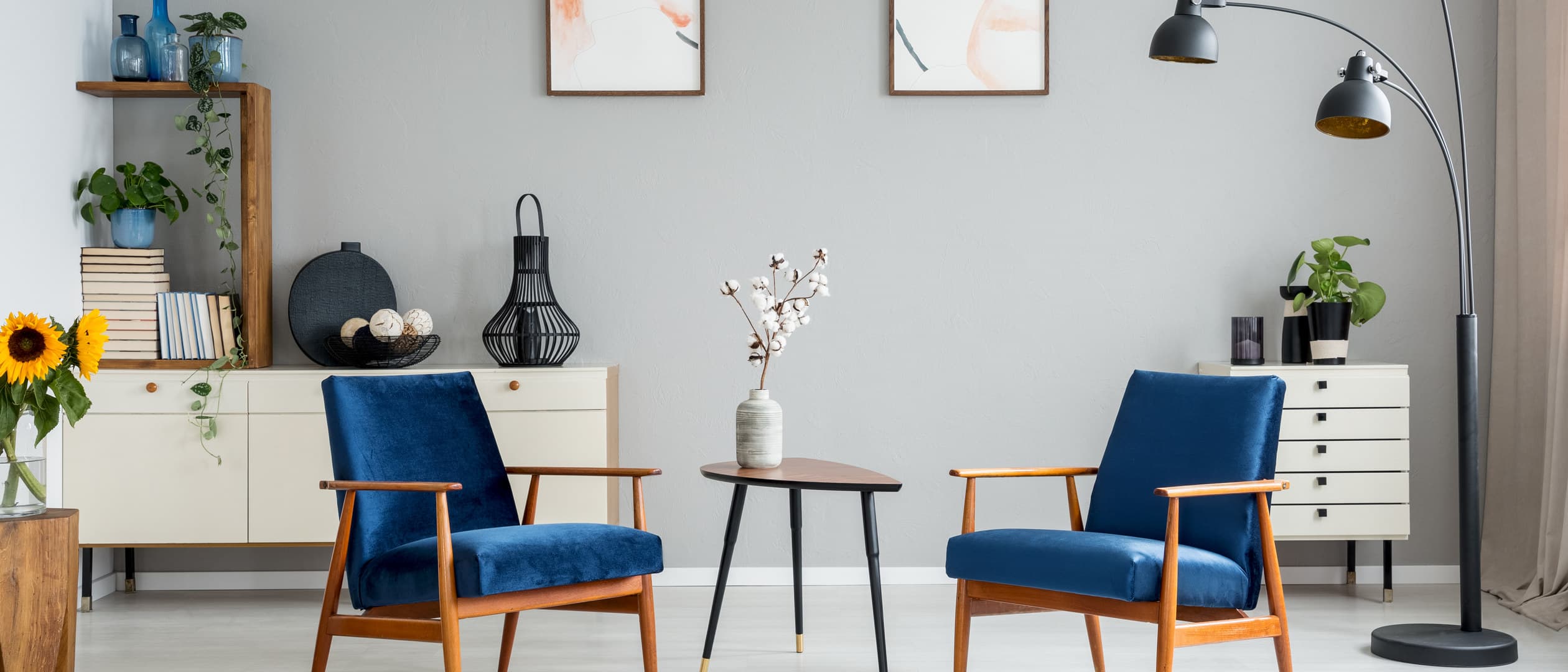 Walnut sideboard with two cane armchairs