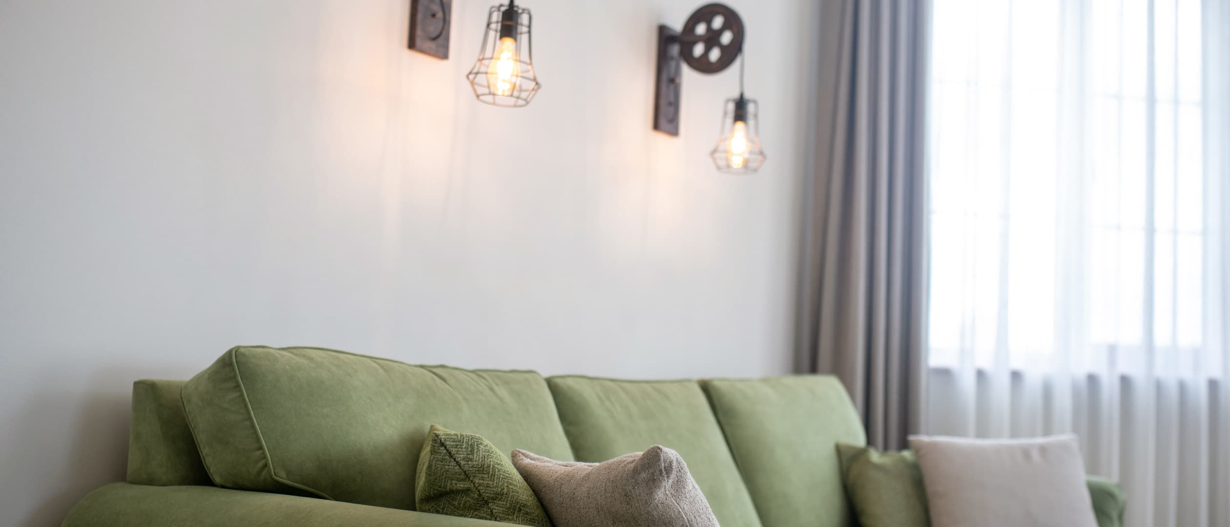 Wall lighting that softens a quiet evening corner.