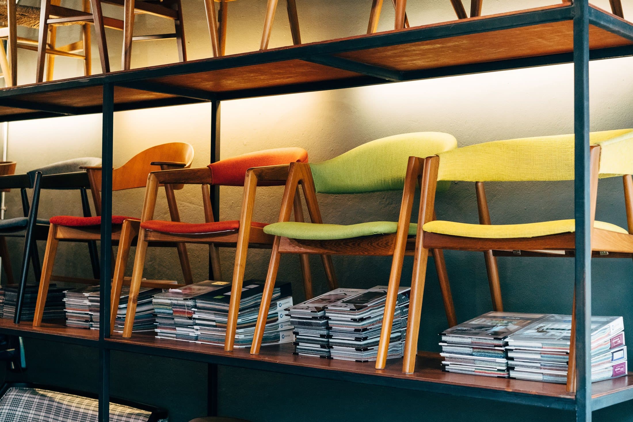 Different wooden chairs displayed together in a furniture shop